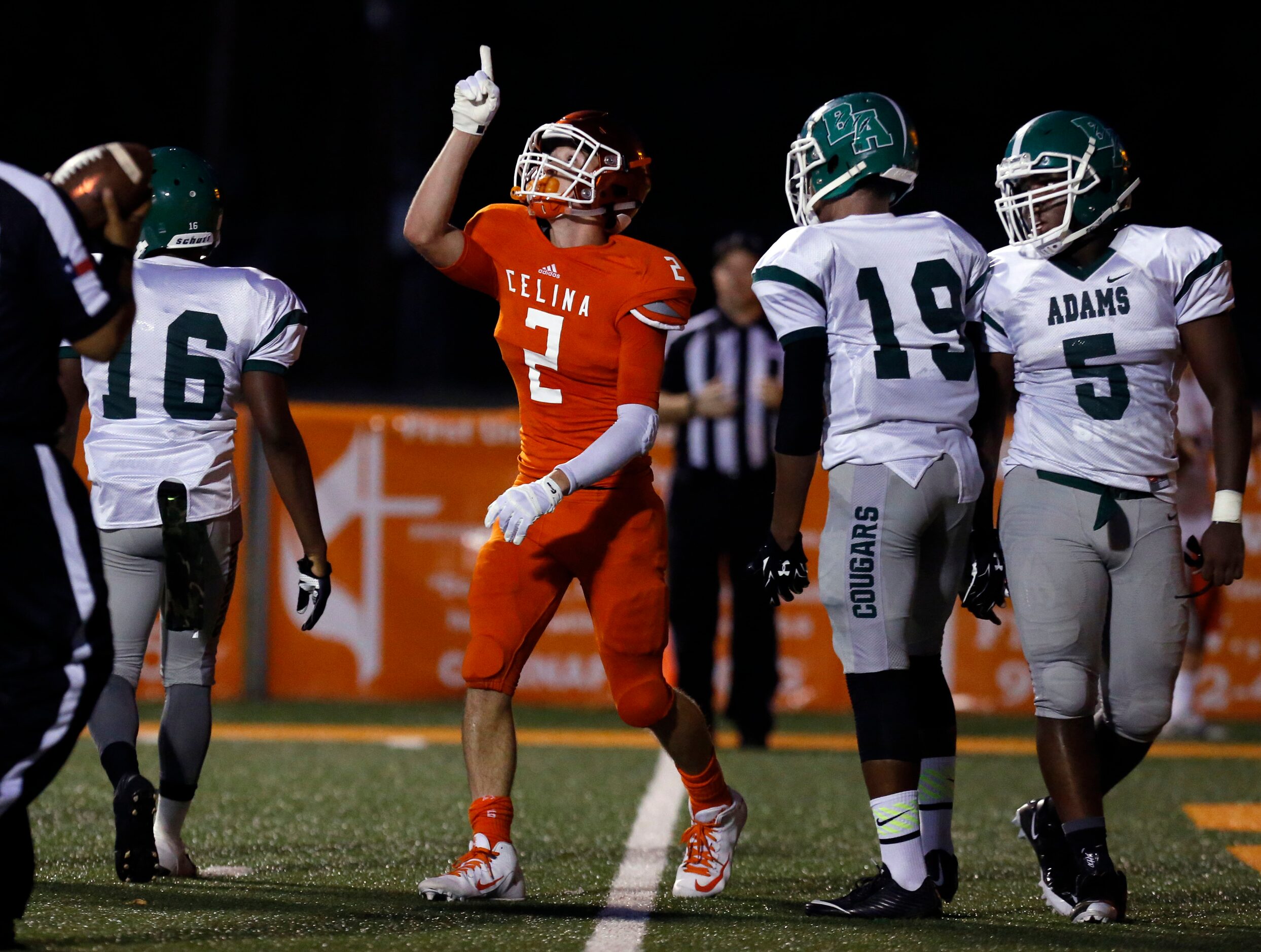 (TXHSFB) Celina High SE Braydon Watson (2) points to the sky after scoring a touchdown, as...