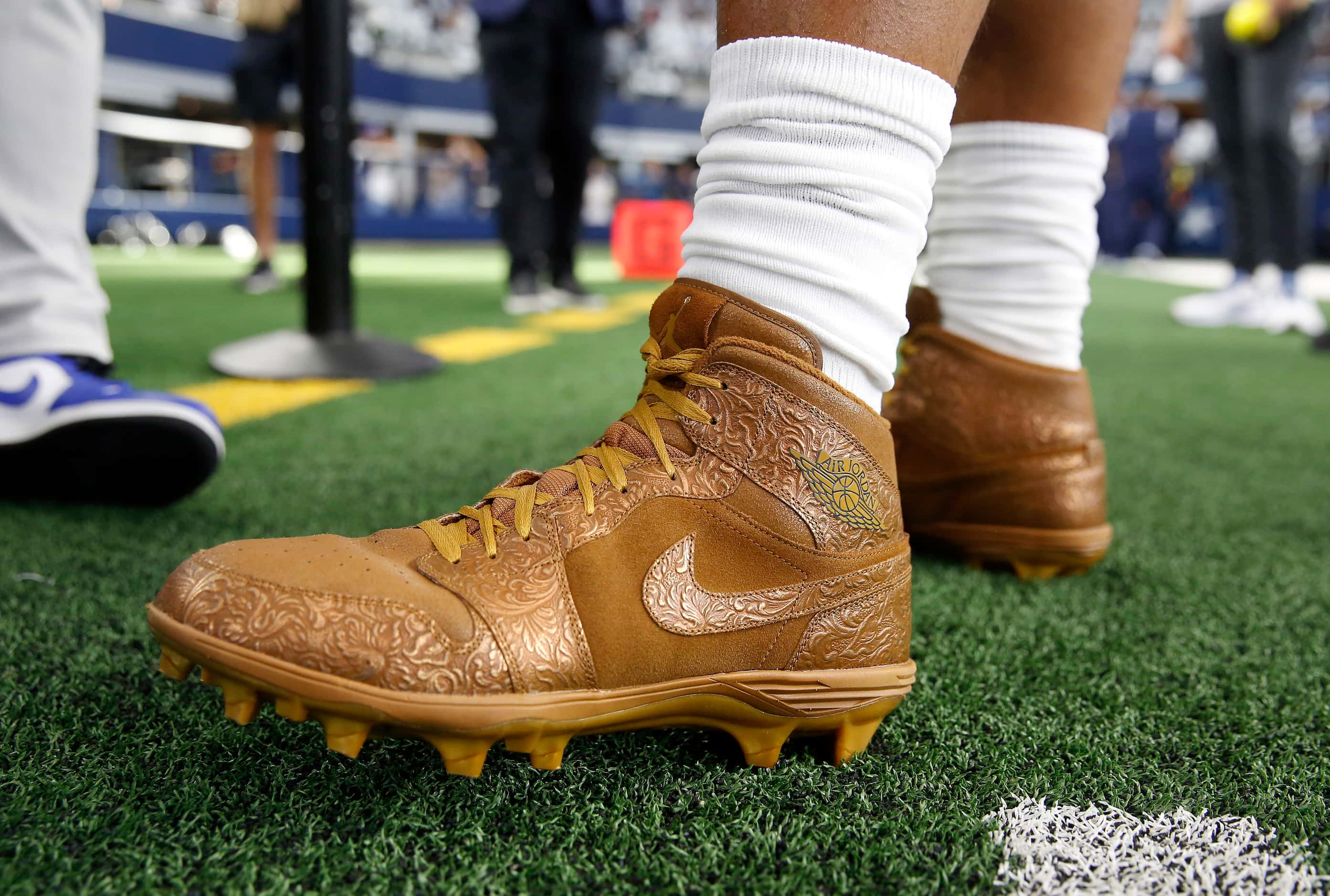 Dallas Cowboys quarterback Dak Prescott warmed up in his Air Jordan shoes, ones he said are...