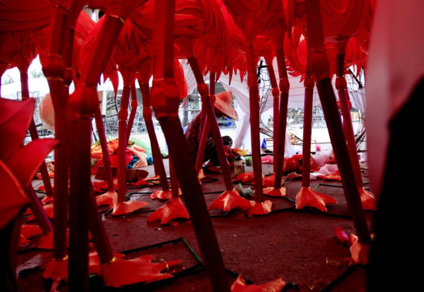 Yufen Luo prepares for the Chinese Lantern Festival at Fair Park. About 45 artists are in...