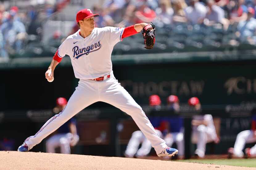 Texas Rangers starting pitcher Kyle Gibson throws against the Toronto Blue Jays in the first...