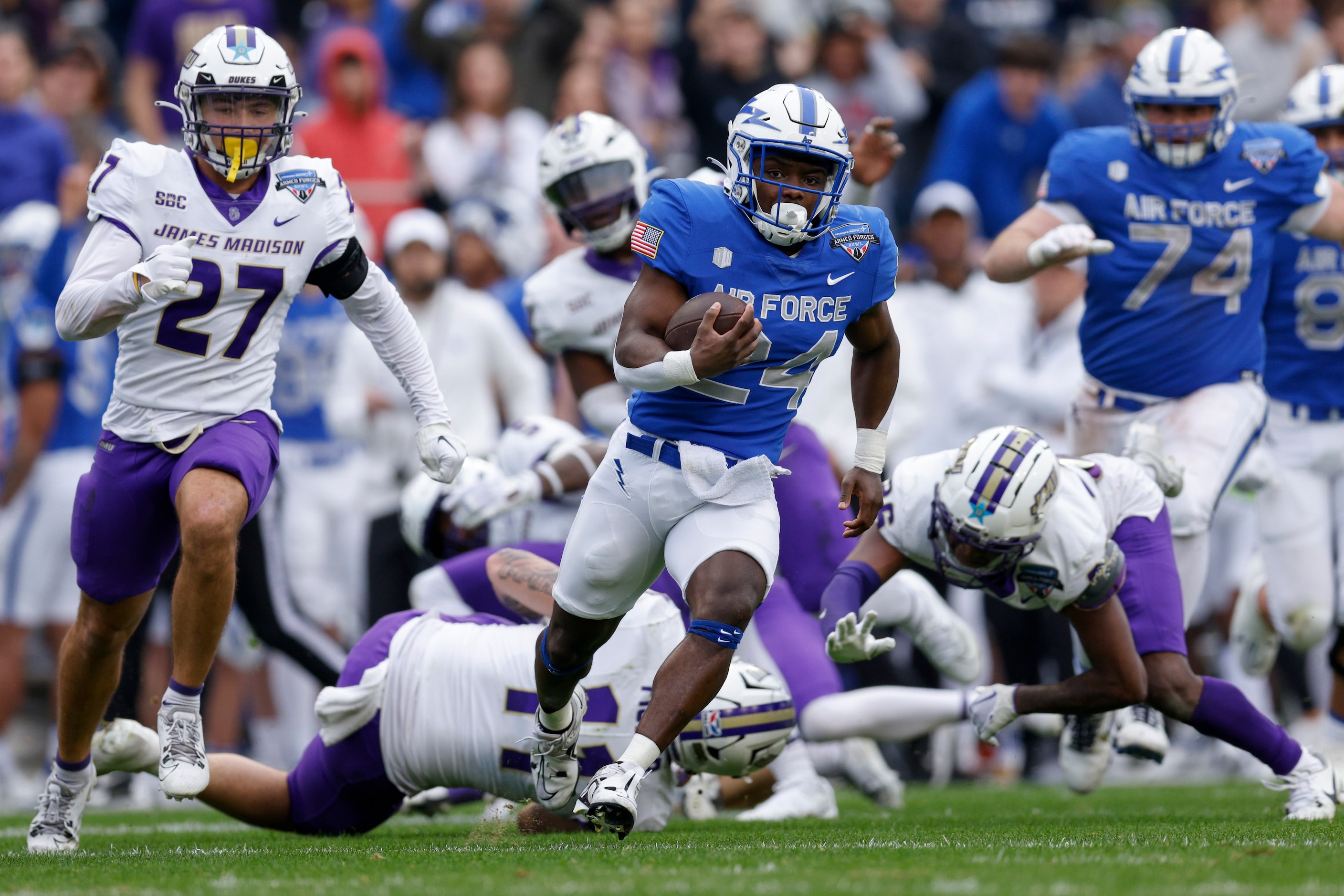 Air Force Falcons running back John Lee Eldridge III (24) runs downfield as James Madison...