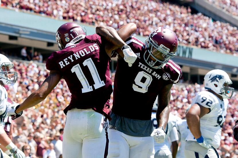 Texas A&M's Josh Reynolds (11) celebrates a first quarter touchdown with teammate Ricky...