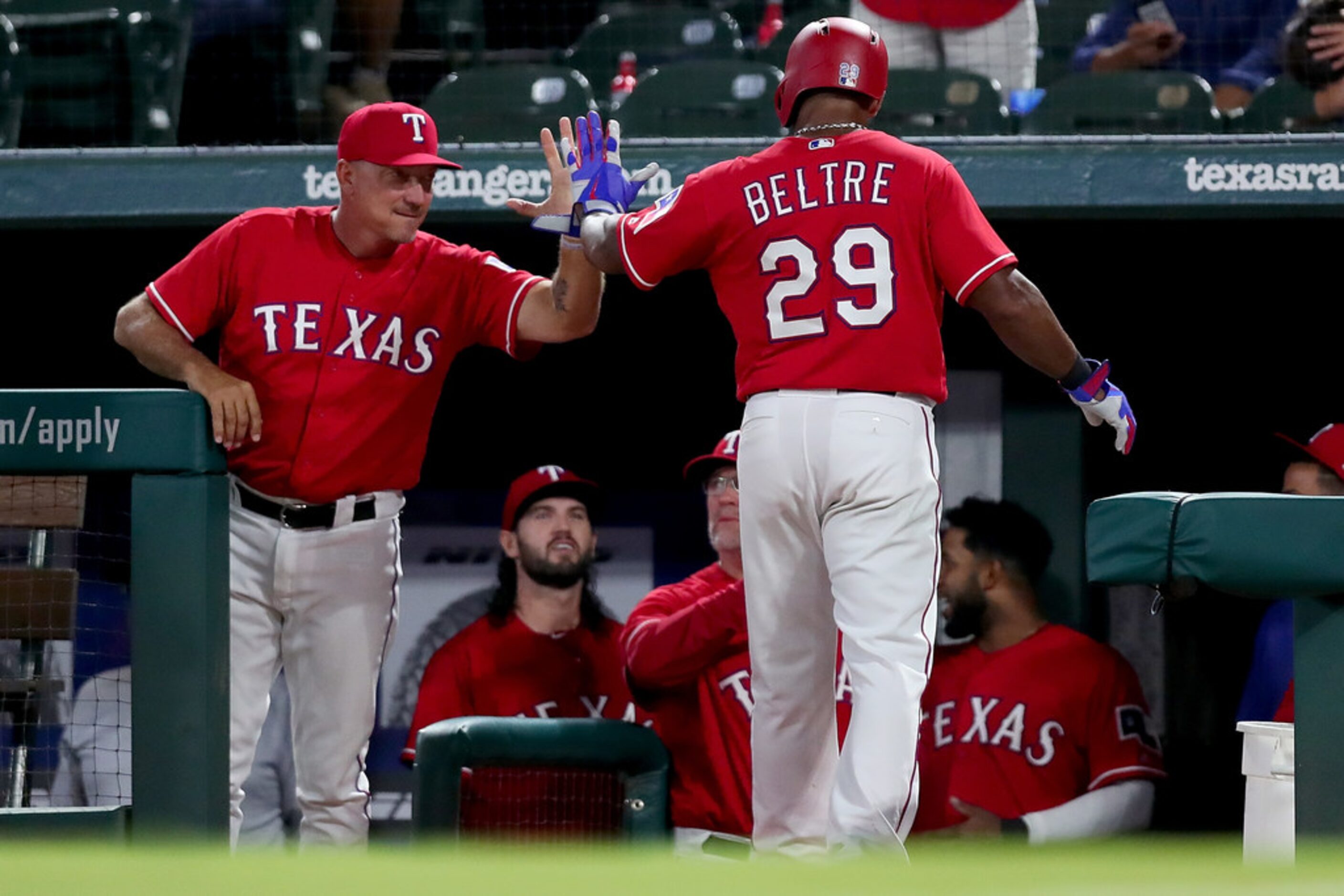 ARLINGTON, TX - AUGUST 13:  Adrian Beltre #29 of the Texas Rangers celebrates with manager...