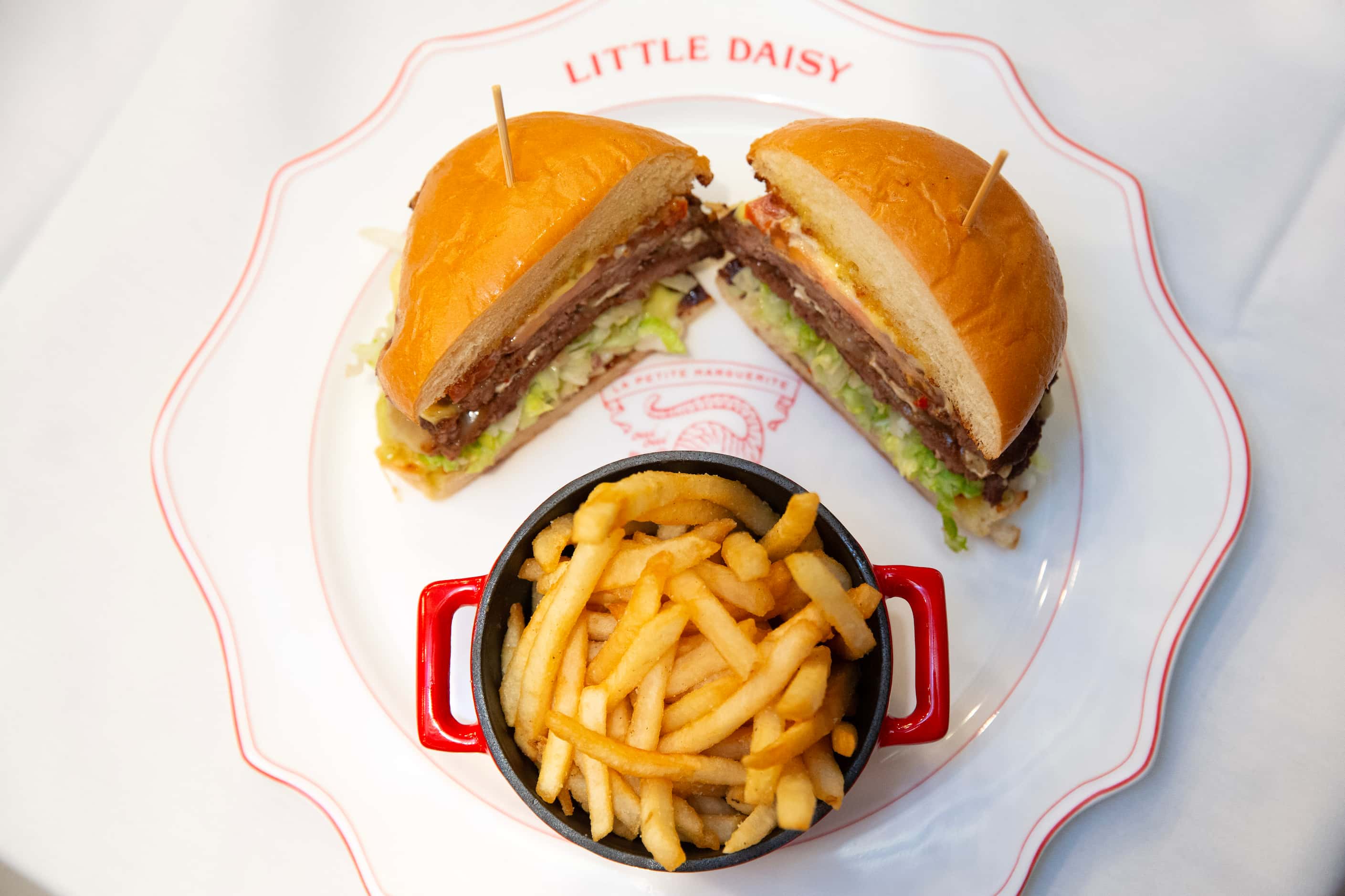 Little Daisy features a Hemingway burger with India relish rouille, Camembert, lettuce,...