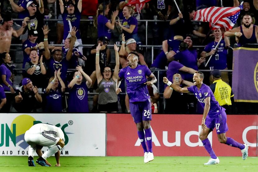Orlando City defender Carlos Ascues (26) celebrates his goal against FC Dallas with teammate...