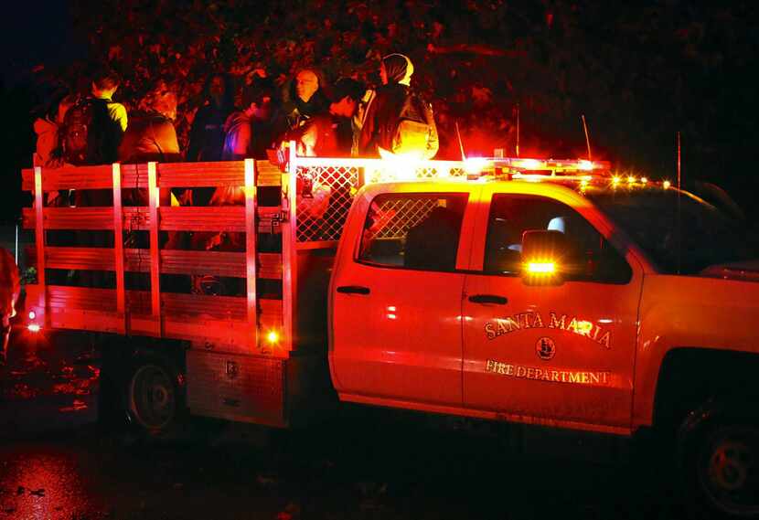 This photo provided by Stacey Wright with the Santa Barbara Urban Hikers shows people being...