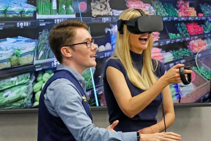 First daughter Ivanka Trump gets some in-store virtual reality training from Walmart's James...