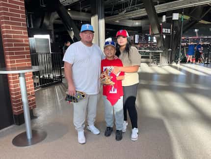 Austin Ramirez, 10, poses for a photo with his parents Americo and Viviana Ramirez before...