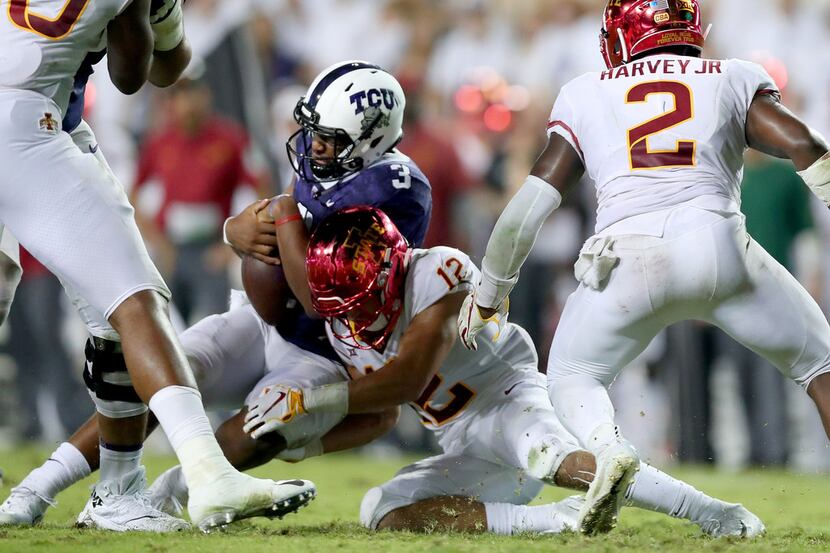 FORT WORTH, TX - SEPTEMBER 29:  Shawn Robinson #3 of the TCU Horned Frogs takes a hit from...