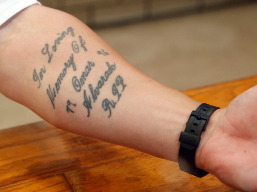 Aaron Dyson shows a tattoo in memory of his friend Omar Alvarado. (Vernon Bryant/The Dallas...