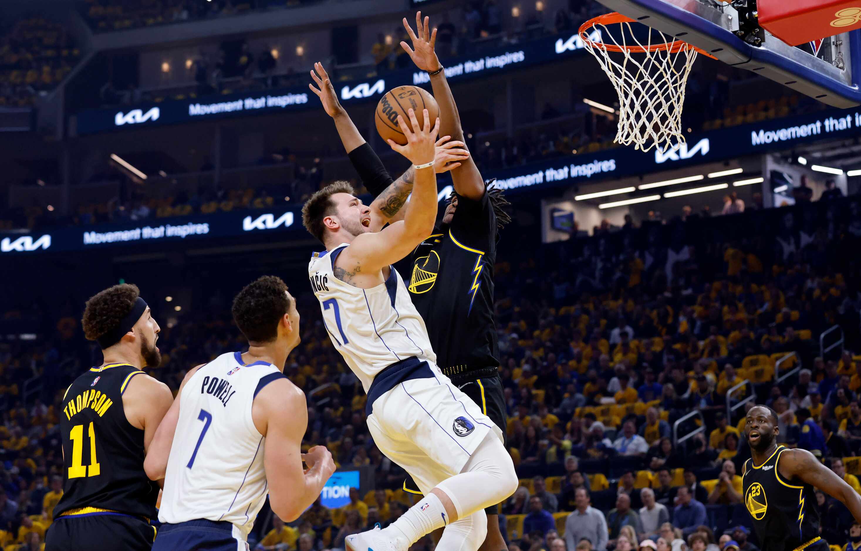 Dallas Mavericks guard Luka Doncic (77) flies to the basket past Golden State Warriors...