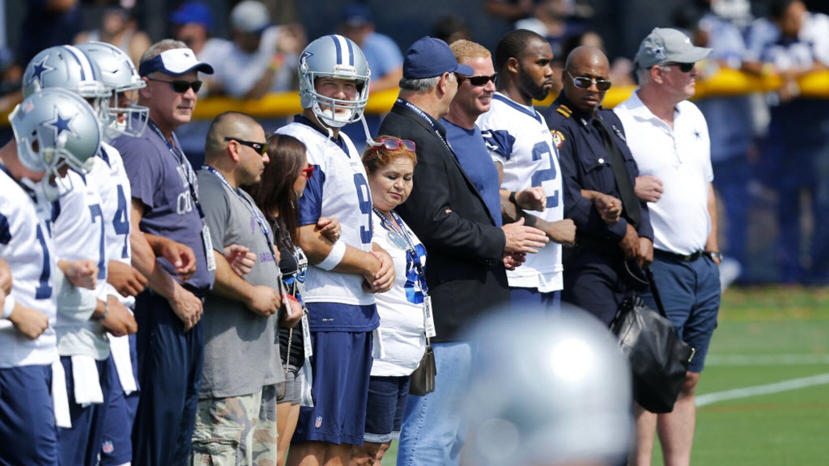 Dallas Cowboys quarterback Tony Romo (9) joined the family of slain officer Patrick...