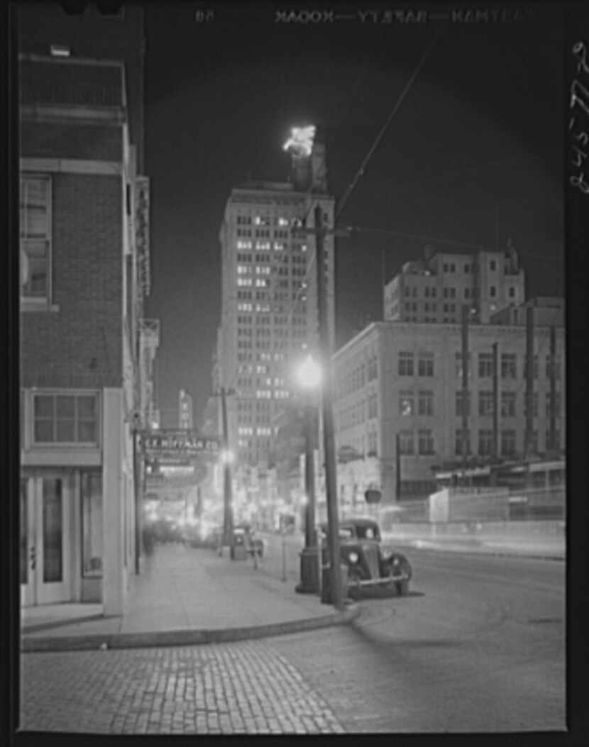 Downtown Dallas at night in January 1942. The Magnolia Oil Company building is in view.