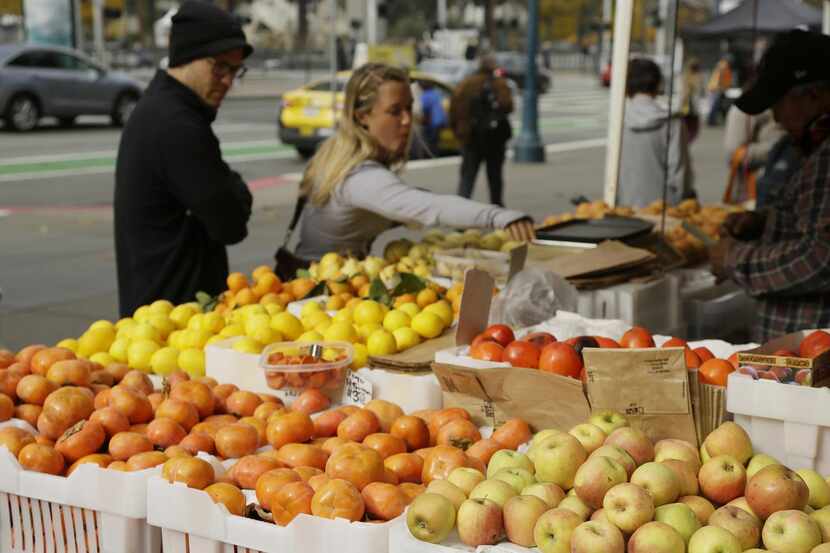 
The farmers market brings color to an already lively street scene. 



