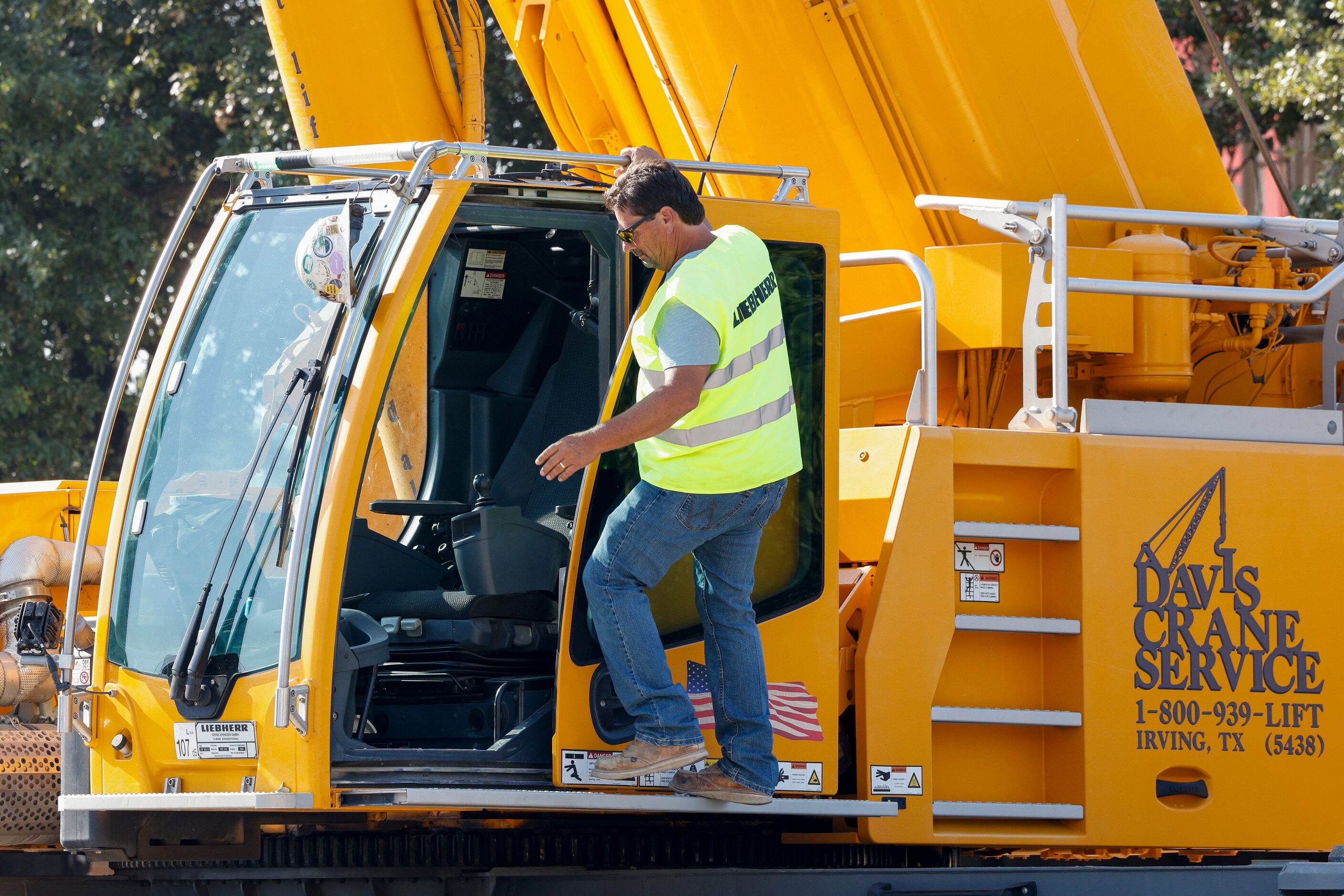 Crane operator Joe Kolanek, 54, steps into the cab to raise Big Tex at The State Fair of...