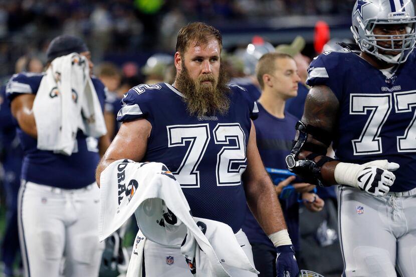 Dallas Cowboys center Travis Frederick (72) and his teammates get ready to go back on the...