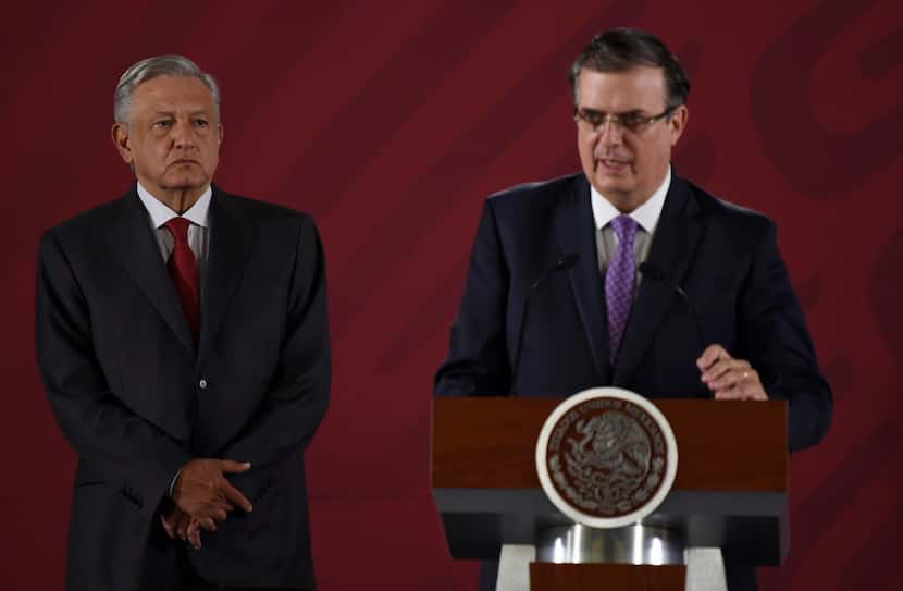 Mexican Foreign Minister Marcelo Ebrard, right, with Mexican President Andres Manuel Lopez...