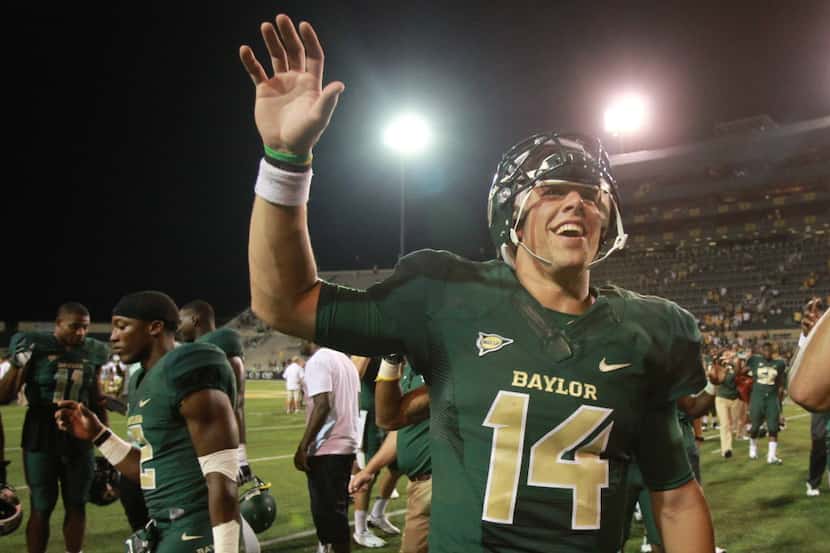 Baylor quarterback Bryce Petty (14) celebrates his team's win over Wofford in an NCAA...