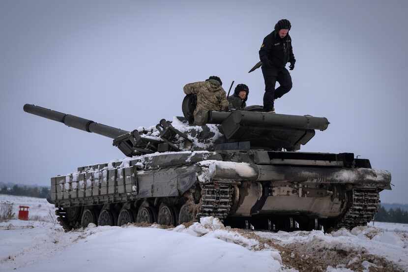 Ukrainian soldiers practice on a tank during military training in Ukraine Wednesday, Dec. 6,...