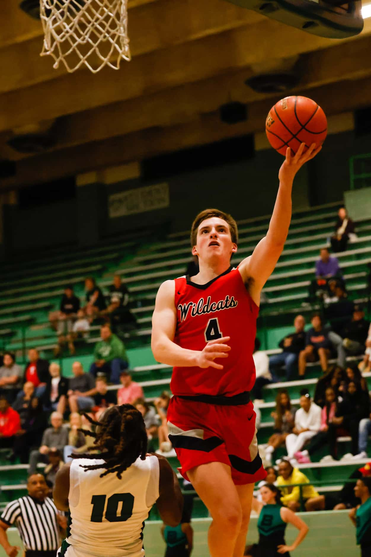 Lake Highlands High School' Warren Hamilton #4 goes for a shot against Berkner High School...