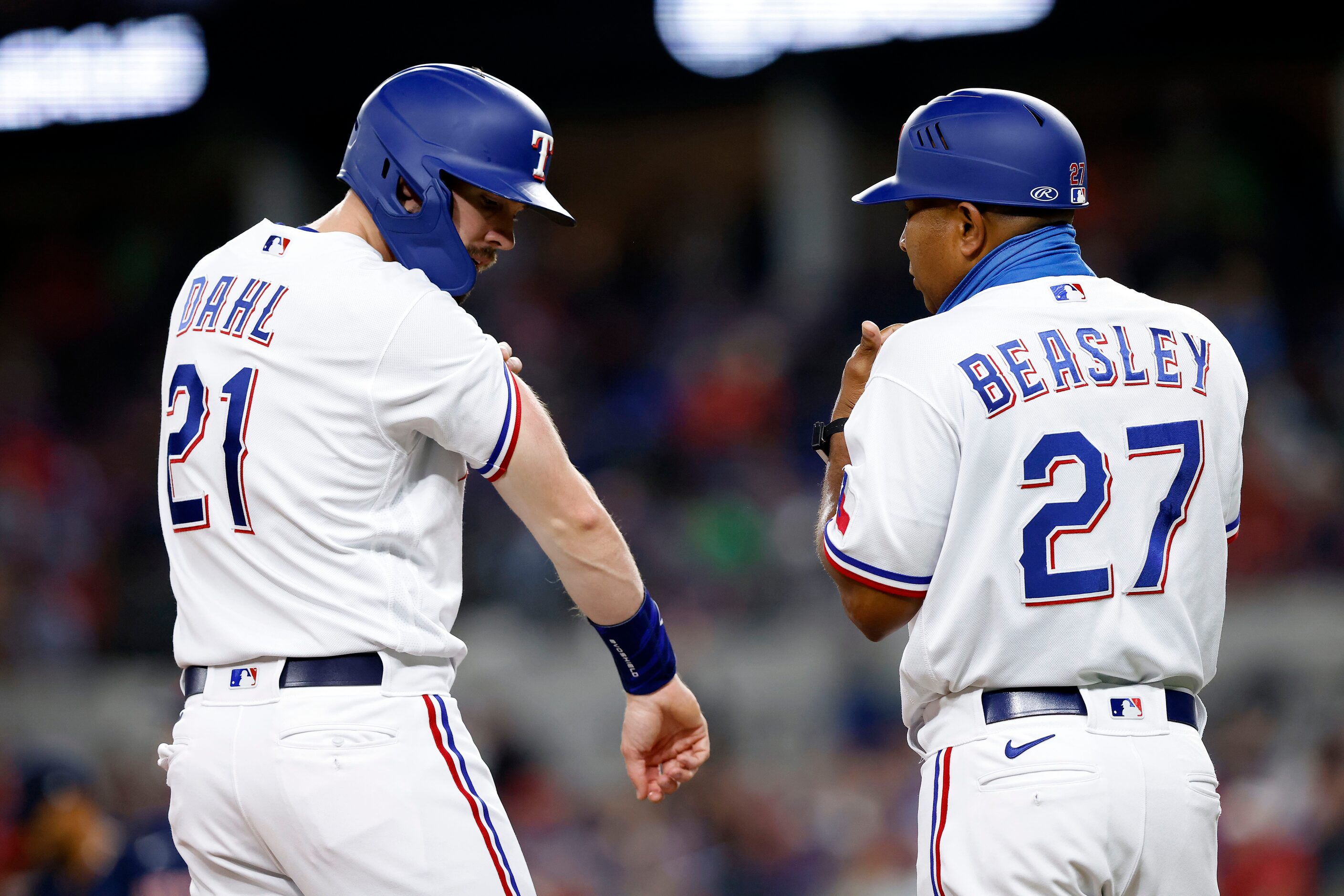 Texas Rangers left fielder David Dahl (21) shows where he was hit by Boston Red Sox starting...