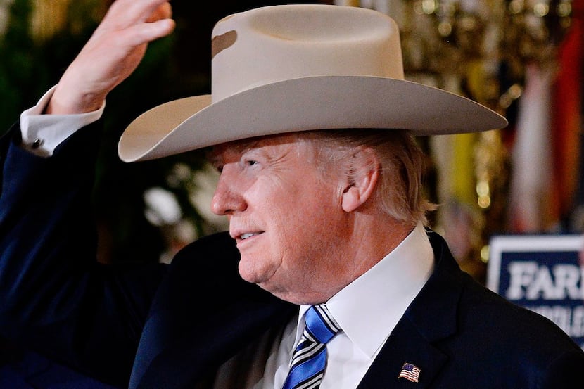 President Donald Trump examines U.S.-made products from all 50 states, including a Stetson...