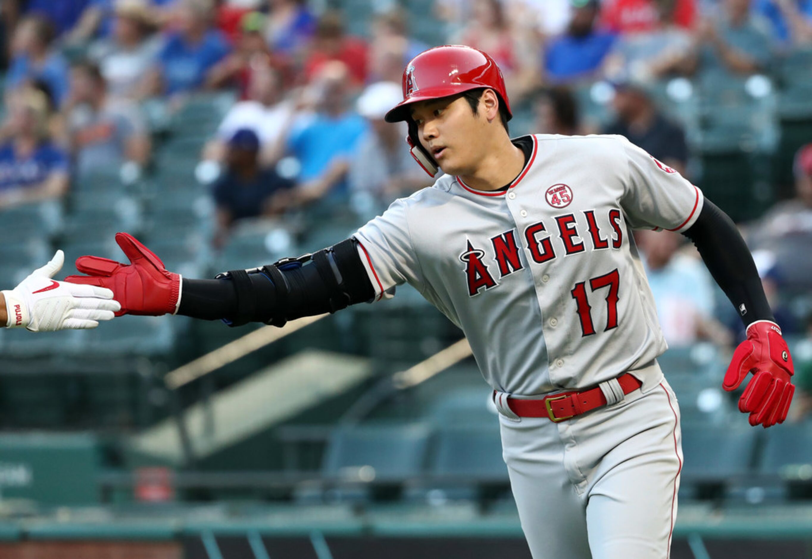 ARLINGTON, TEXAS - AUGUST 19:  Shohei Ohtani #17 of the Los Angeles Angels celebrates a run...