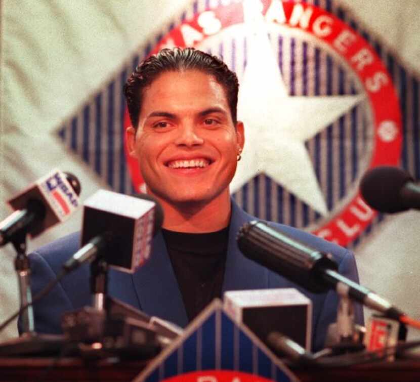ORG XMIT:  Texas Ranger's star catcher Ivan 'Pudge' Rodriguez was ALL smiles, as he talked...
