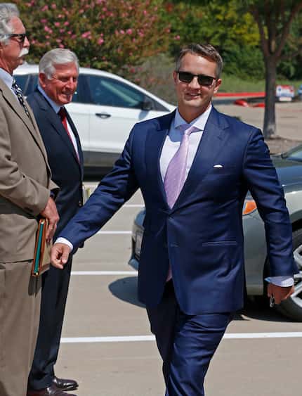 Wade Blackburn (right) left the federal courthouse in Plano after his sentencing hearing on...