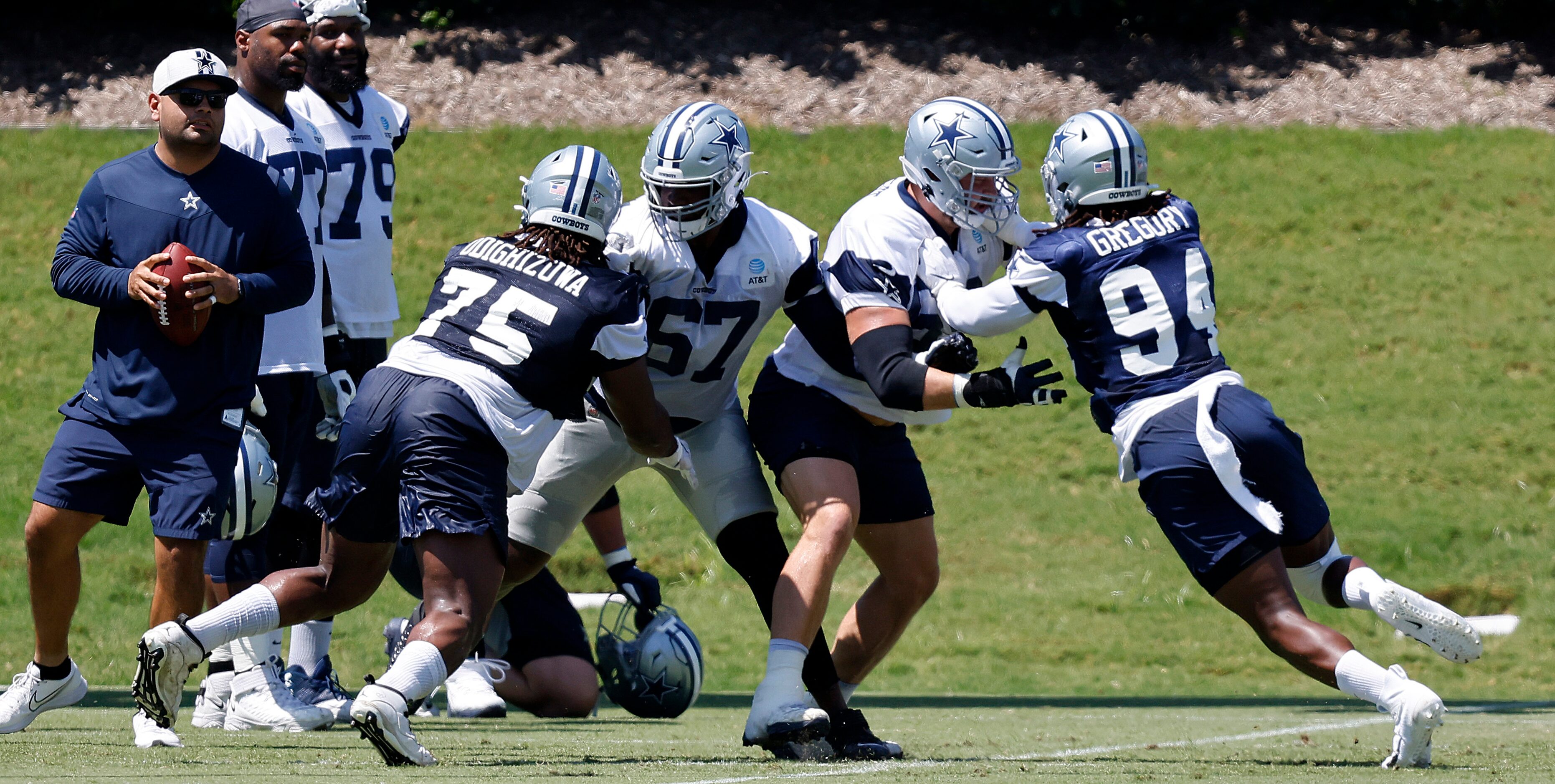 Dallas Cowboys defensive tackle Osa Odighizuwa (75) and defensive end Randy Gregory (94)...