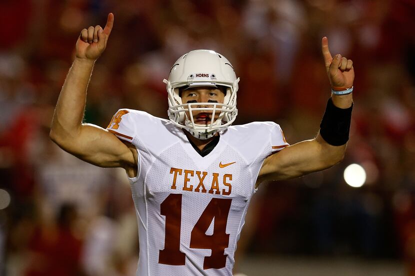 OXFORD, MS - SEPTEMBER 15:  David Ash #14 of the Texas Longhorns celebrates after a first...