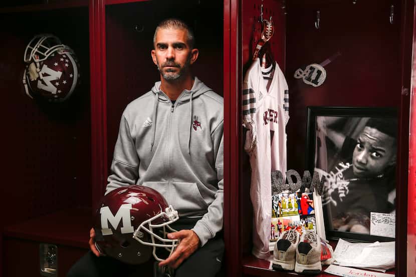 Mesquite football coach Jeff Fleener poses for a photograph next to the locker of former...