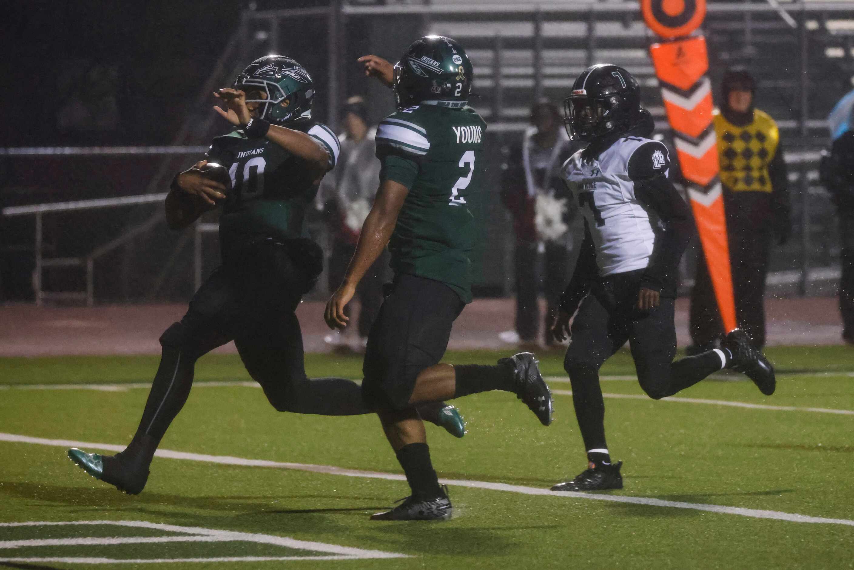 Waxahachie High School’s Roderick Hartsfield Jr. (10), competes a touchdown against...