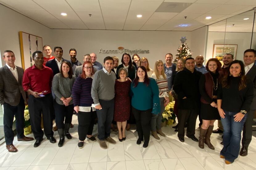 Access Physicians employees are shown at a holiday party last year. The company is a...