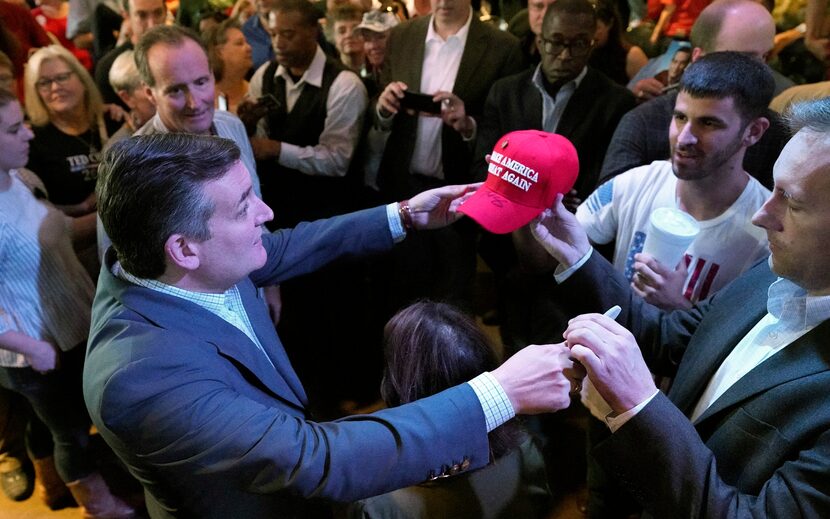 Sen. Ted Cruz, R-Texas, left, greets the crowd during a campaign event Monday, Nov. 5, 2018,...