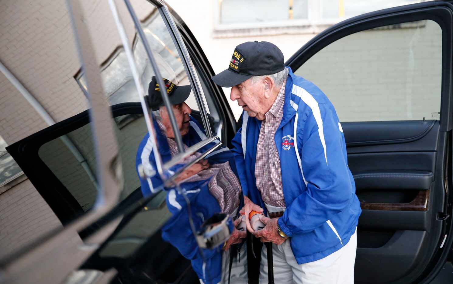 Chester Hollingsworth grabs his chocolate milk as his private driver Willie Evans drops him...