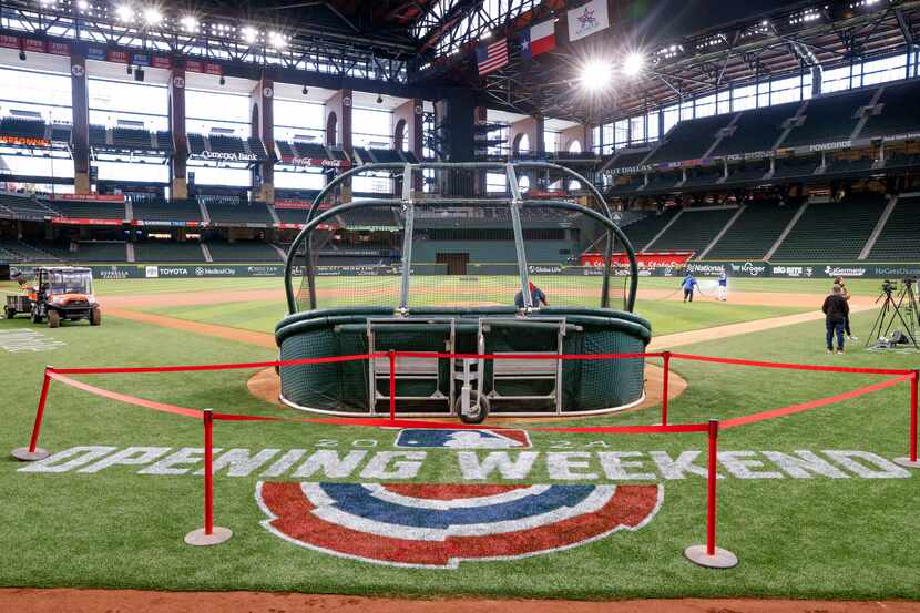A MLB Opening Weekend logo is seen on the field at Globe Life Field, Wednesday, March 27,...