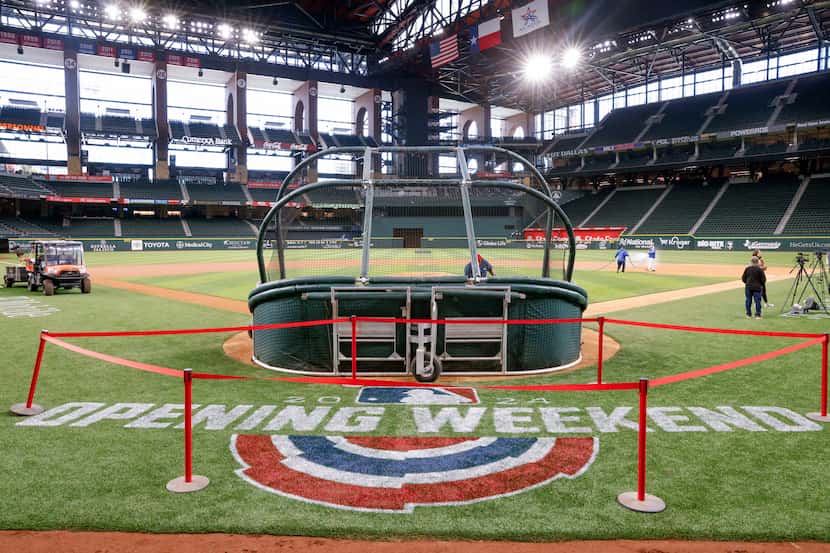 A MLB Opening Weekend logo is seen on the field at Globe Life Field, Wednesday, March 27,...
