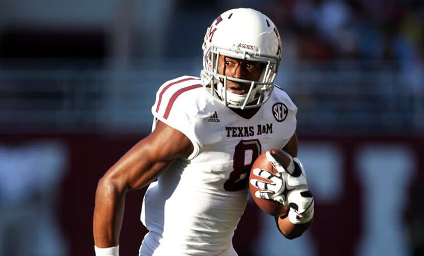Former Dallas Skyline star Thomas Johnson runs after making one of his three receptions in...