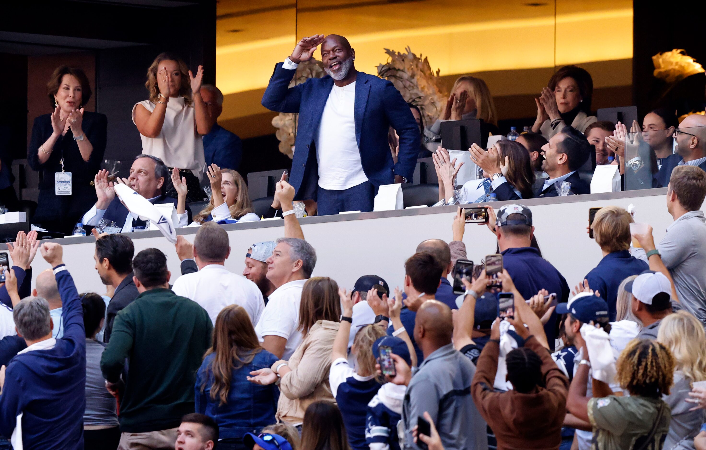 Former Dallas Cowboys running back Emmitt Smith waves to the crowd after being recognized on...