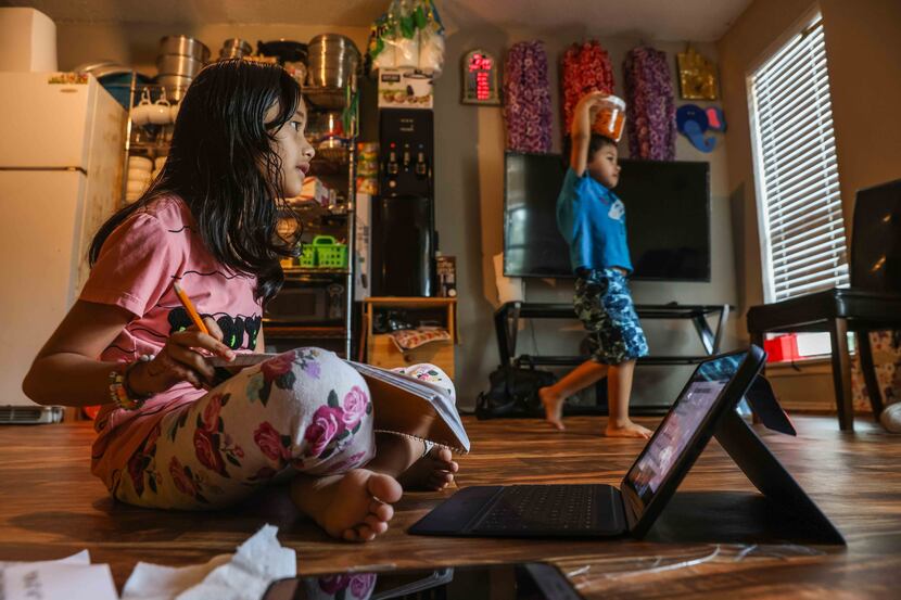 Zakirah Binti Mohammad Yasin, 7, attends a tutoring session by McShan Elementary School from...