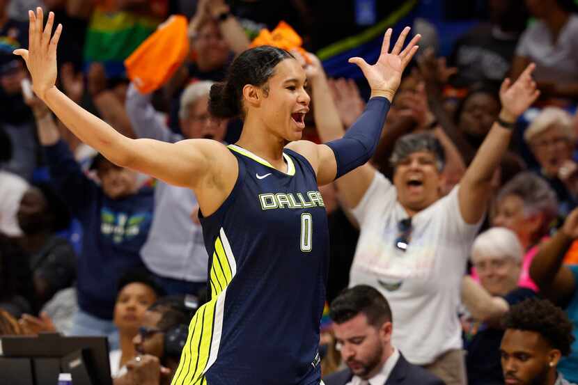 Dallas Wings forward Satou Sabally (0) pumps up the crowd as she heads to the bench during...