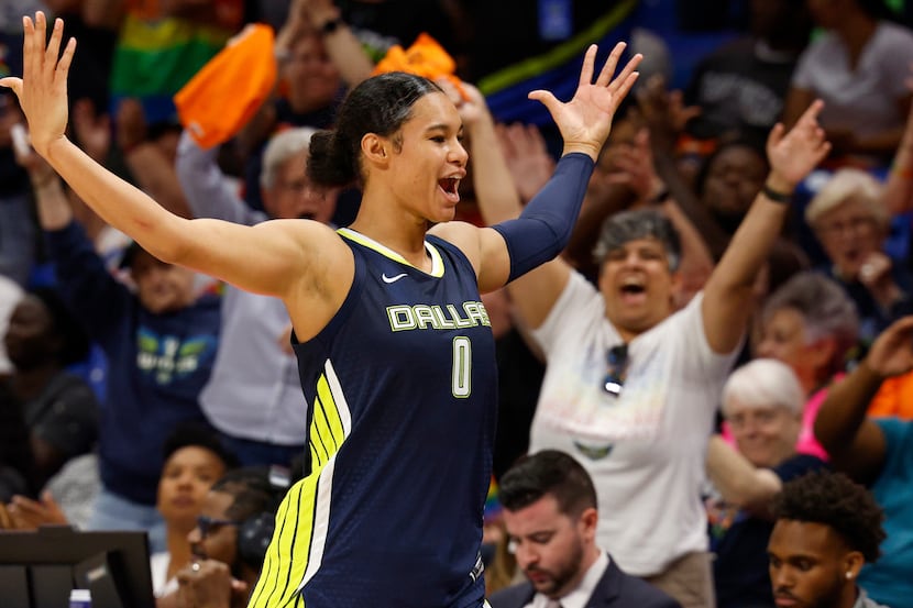 Dallas Wings forward Satou Sabally (0) pumps up the crowd as she heads to the bench during...