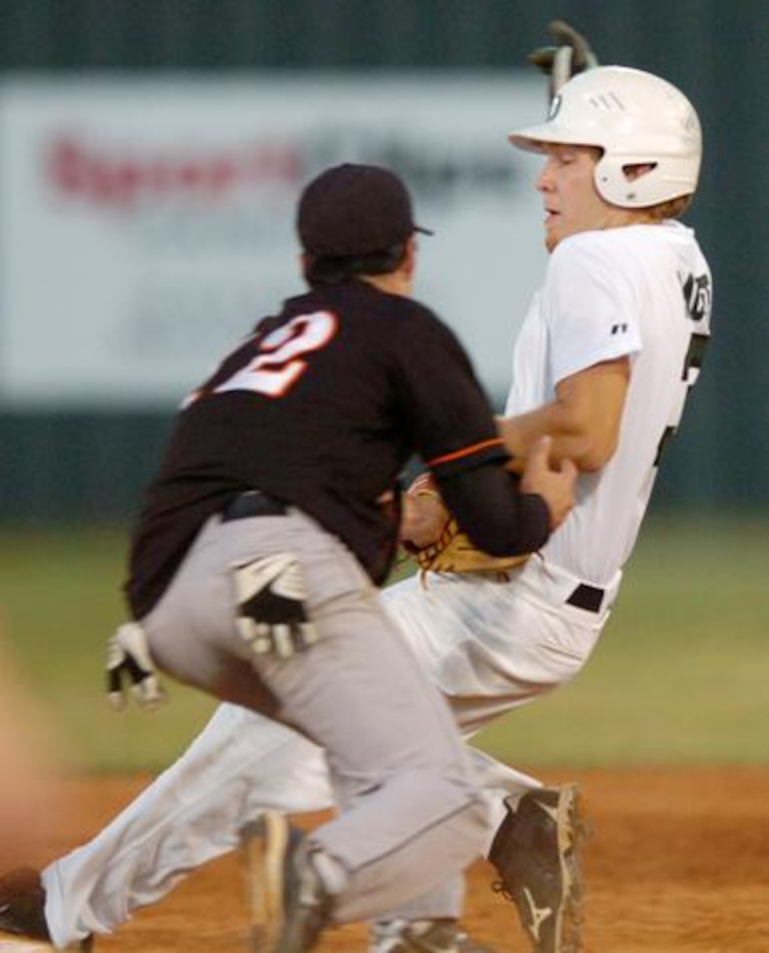 Lake Dallas' Tyler McGee (3) barely evades a tag at second by Aledo's Matt Bishop (12),...