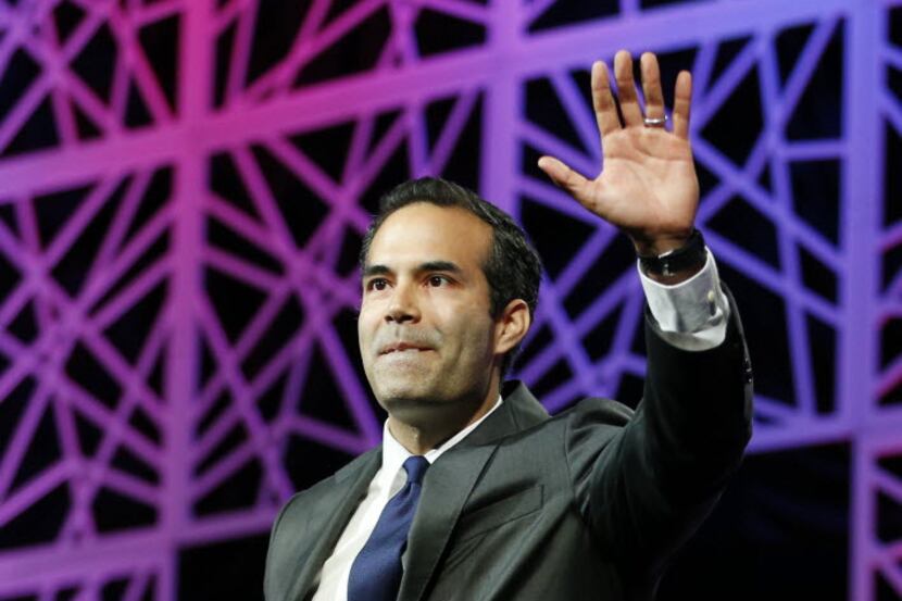 Texas Land Commissioner George P. Bush waves to the crowd during the 2016 Texas Republican...