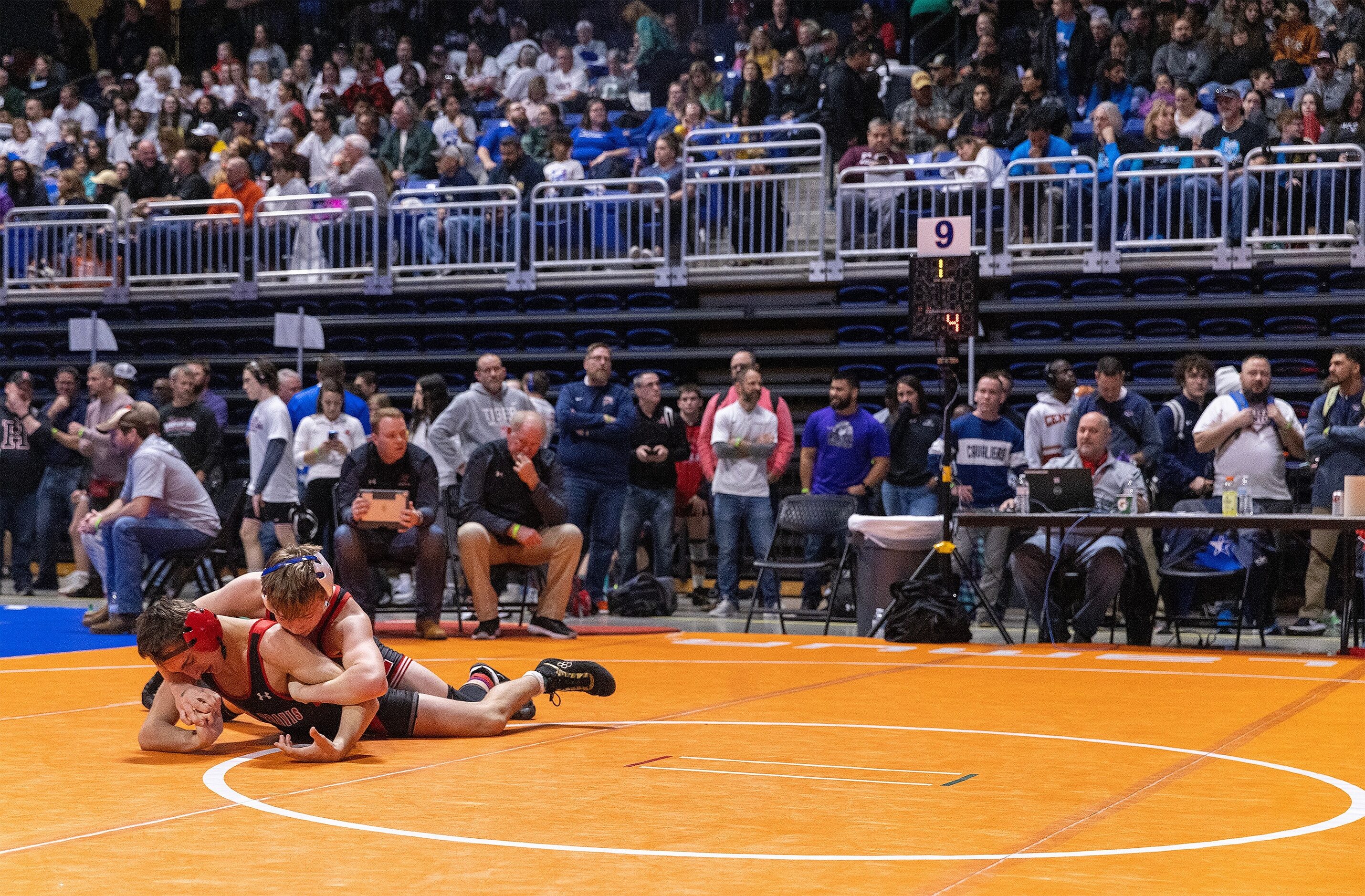 Joseph Liescheski from Allen (top) wrestles Will Deutschlander from Austin Lake Travis in...