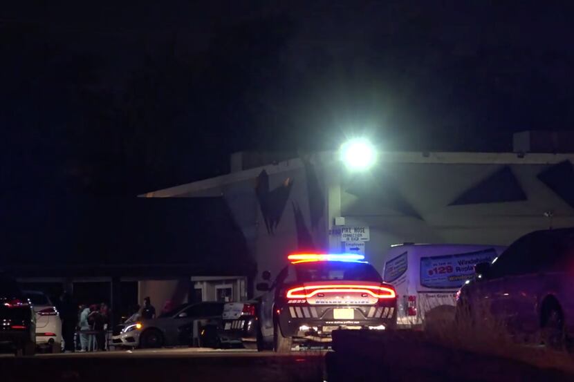 Police at the scene of a shooting that left three dead in northwest Dallas early Oct. 25.