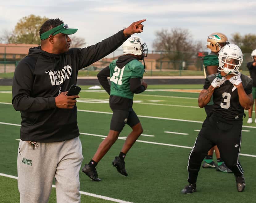 DeSoto High School head coach Claude Mathis points during practice at Eagle Stadium,...