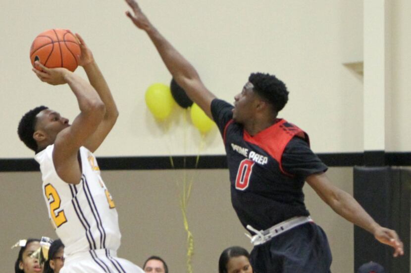 Prime Prep's Emmanuel Mudiay (0) goes high to defend a jump shot attempt from Triple A...
