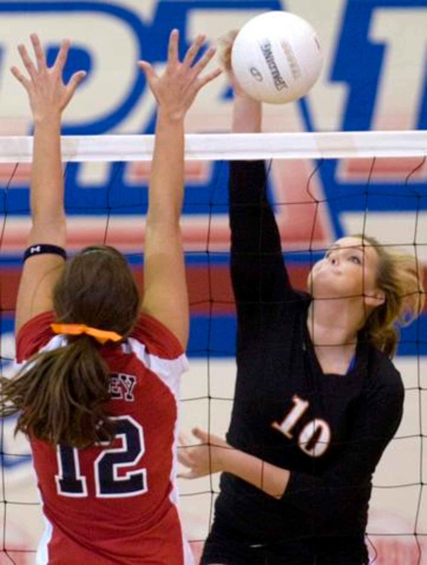 Pilot Point's Lizzie Allen (10) hits against Aubrey's Jamie Teague (12) during a District...